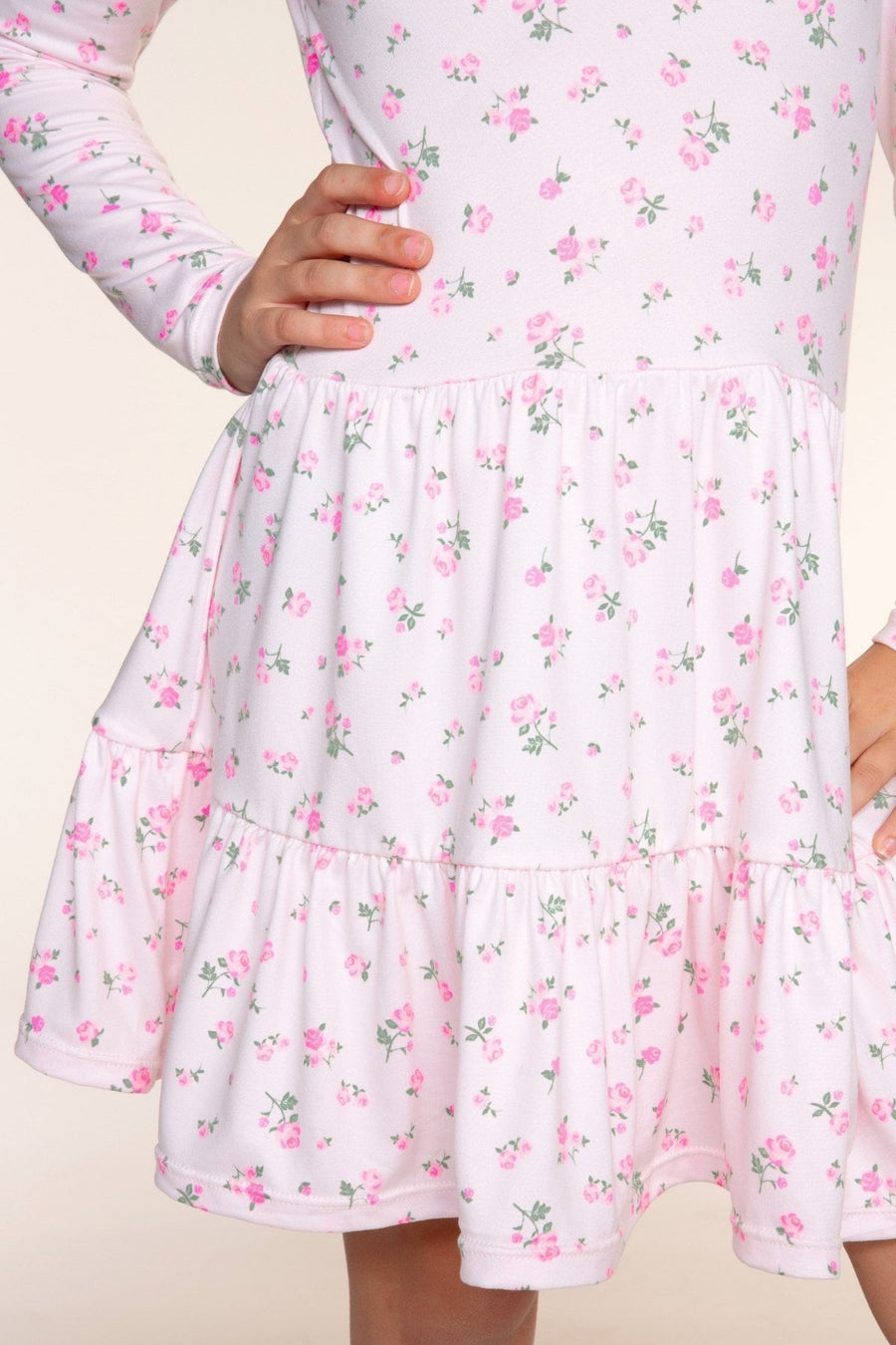 Close-up of the shirred waist and tiered skirt of the Tiered Dress in Pink Ditsy Floral