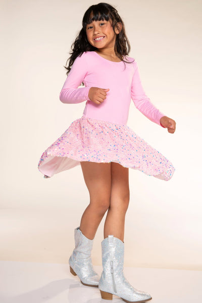 A girl jumping in the Simply Soft Long Sleeve Sequin Be Happy Dress, Hot Pink Black Sequin
